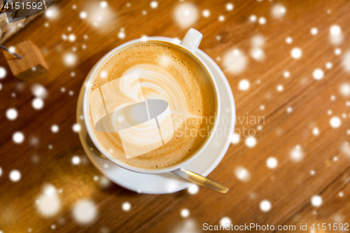 Image of close up of coffee cup with heart shape drawing