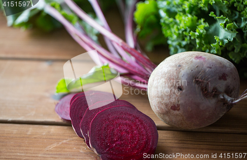 Image of close up of sliced beet on wood