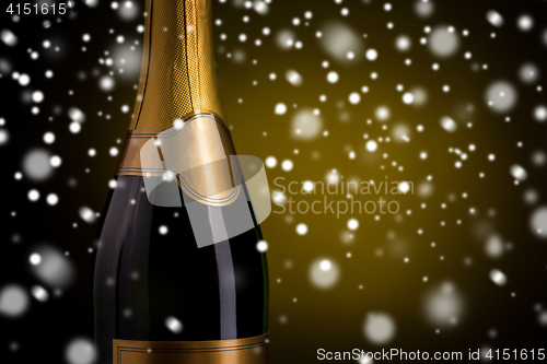 Image of close up of champagne bottle with golden label