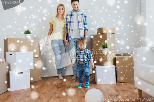 Image of happy family moving to new home and playing ball