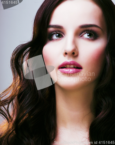 Image of young pretty woman with hairstyle waves, luxury look close up