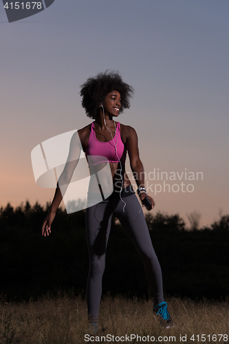 Image of black woman is doing stretching exercise relaxing and warm up