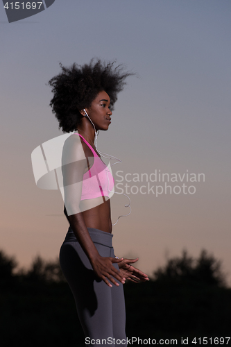 Image of black woman is doing stretching exercise relaxing and warm up