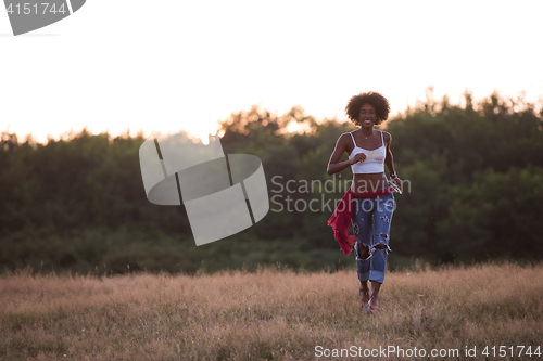 Image of young black woman in nature