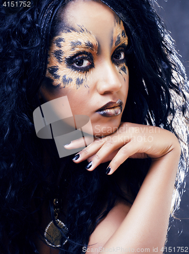 Image of beauty afro girl with cat make up, creative leopard print