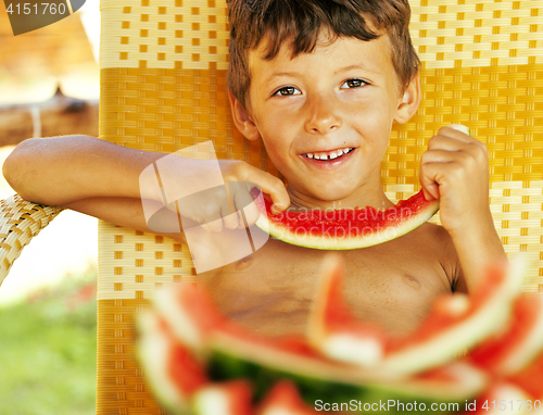 Image of cute young little boy with watermelon crustes smiling