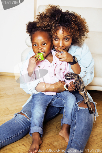 Image of adorable sweet young afro-american mother with cute little daugh