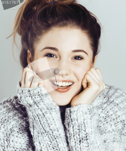 Image of beauty young real woman in sweater at winter warmed up