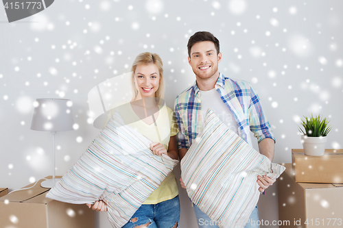 Image of happy couple with stuff moving to new home