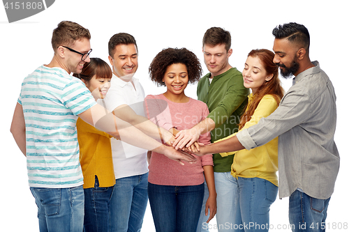 Image of international group of happy people holding hands