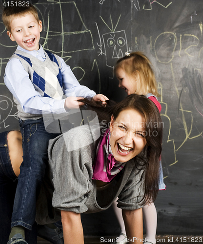 Image of teacher with crazy kid in classroom fighting, lifestyle education people concept