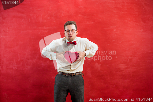 Image of Young beautiful man with abstract heart