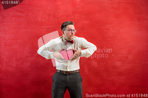 Image of Young beautiful man with abstract heart