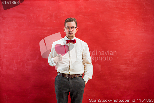 Image of Young beautiful man with abstract heart