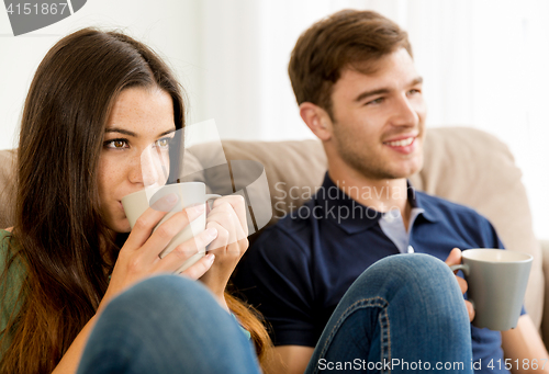 Image of Young couple drinking coffee