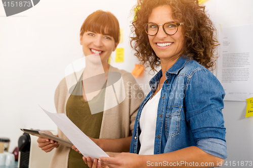 Image of Two businesswoman working together