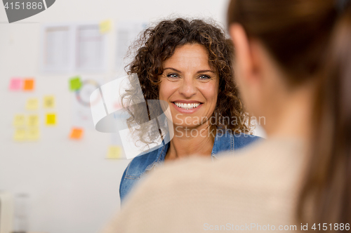 Image of Two businesswoman working together