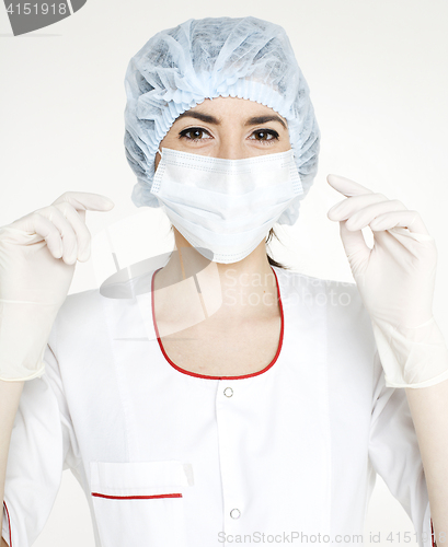 Image of young pretty woman doctor with stethoscope wearing mask