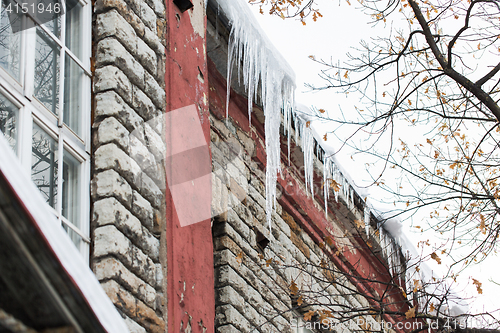 Image of icicles on building or living house facade