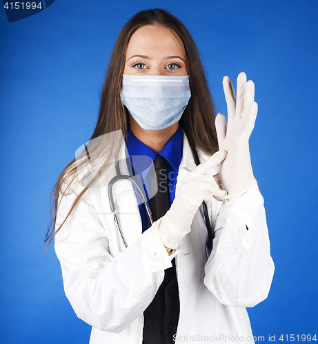 Image of young pretty woman doctor with stethoscope wearing mask