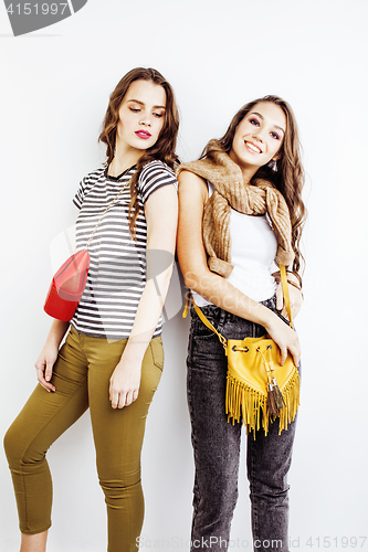 Image of two best friends teenage girls together having fun, posing emotional on white background, besties happy smiling, lifestyle people concept