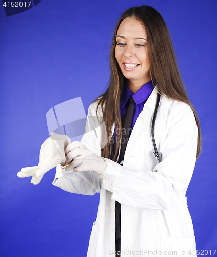 Image of young pretty woman doctor with stethoscope wearing mask