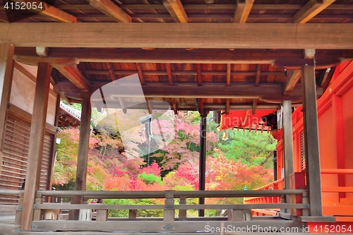 Image of Autumn colors through a temple corridor at Bishamondo