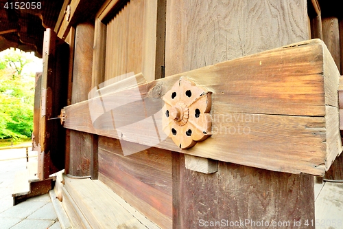 Image of Rusty ornamental wall support of Japanese pagoda