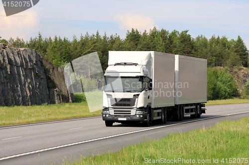 Image of Big White Cargo Truck on Motorway