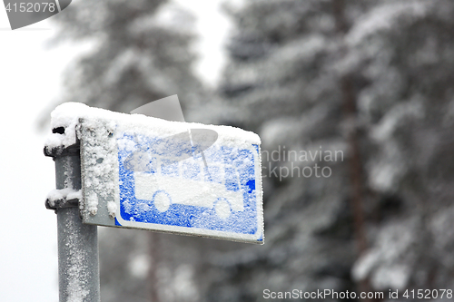 Image of Bus Stop Sign in Winter Snow