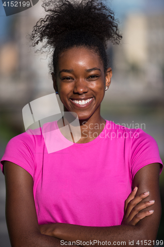 Image of Portrait of sporty young african american woman running outdoors