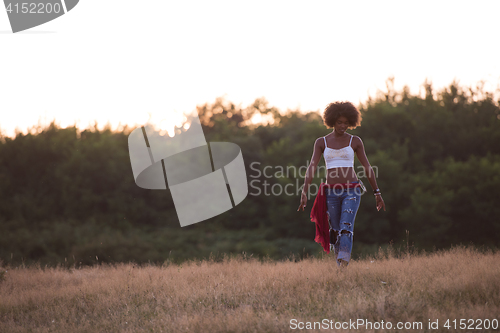 Image of young black woman in nature