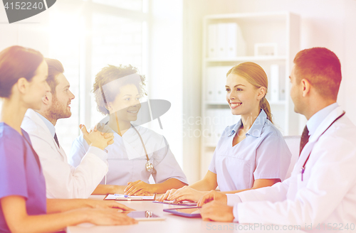 Image of group of happy doctors meeting at hospital office