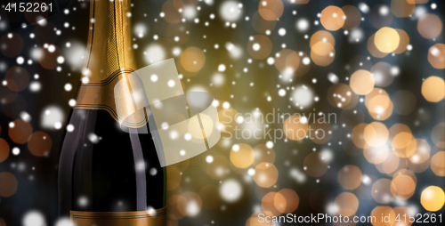 Image of close up of champagne bottle with golden label