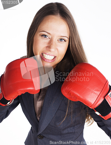 Image of portrait of business woman boxing in red gloves. business activity