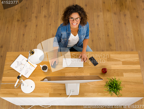 Image of Businesswoman working at the office