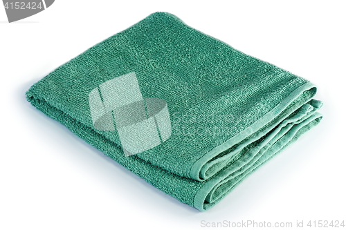 Image of green towel over white