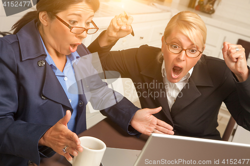 Image of Businesswomen Celebrate Success on the Laptop