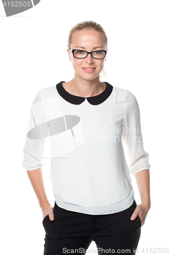 Image of Business woman standing arms in pockets against white background..