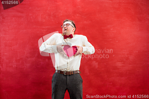 Image of Young funny man with abstract heart