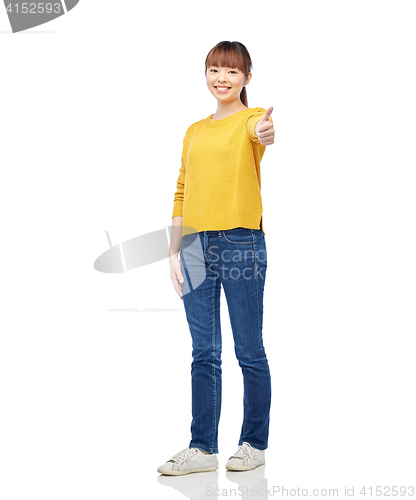 Image of happy asian woman showing thumbs up