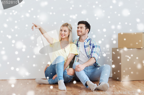 Image of couple with boxes moving to new home and dreaming