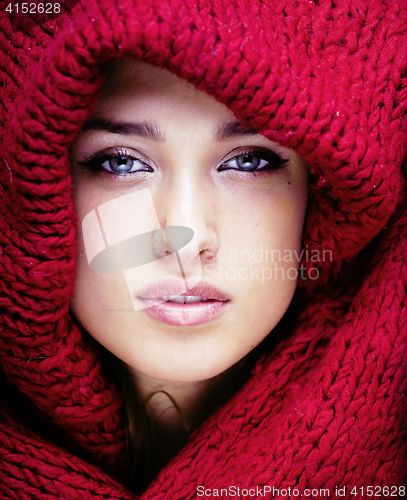 Image of young pretty woman in sweater and scarf all over her face, lifestyle winter people concept