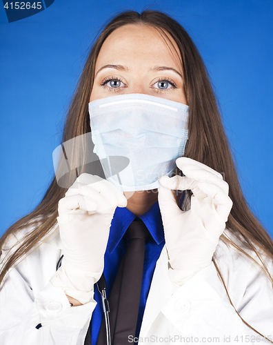 Image of young pretty woman doctor with stethoscope wearing mask