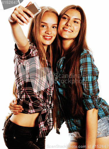 Image of cute teenage girls making selfie isolated