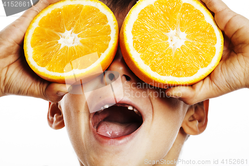 Image of little cute boy with orange fruit double isolated on white smili