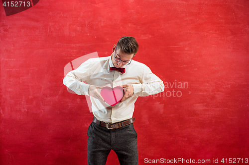 Image of Young funny man with abstract heart