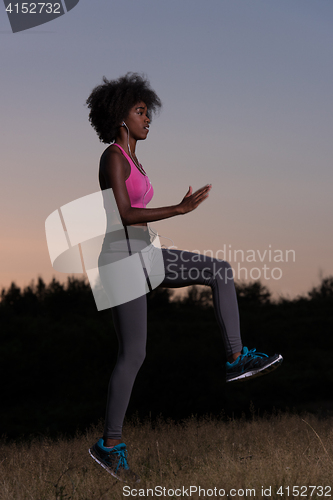 Image of black woman is doing stretching exercise relaxing and warm up