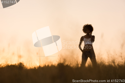 Image of young black woman in nature