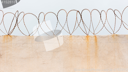 Image of Barbed wire on wall